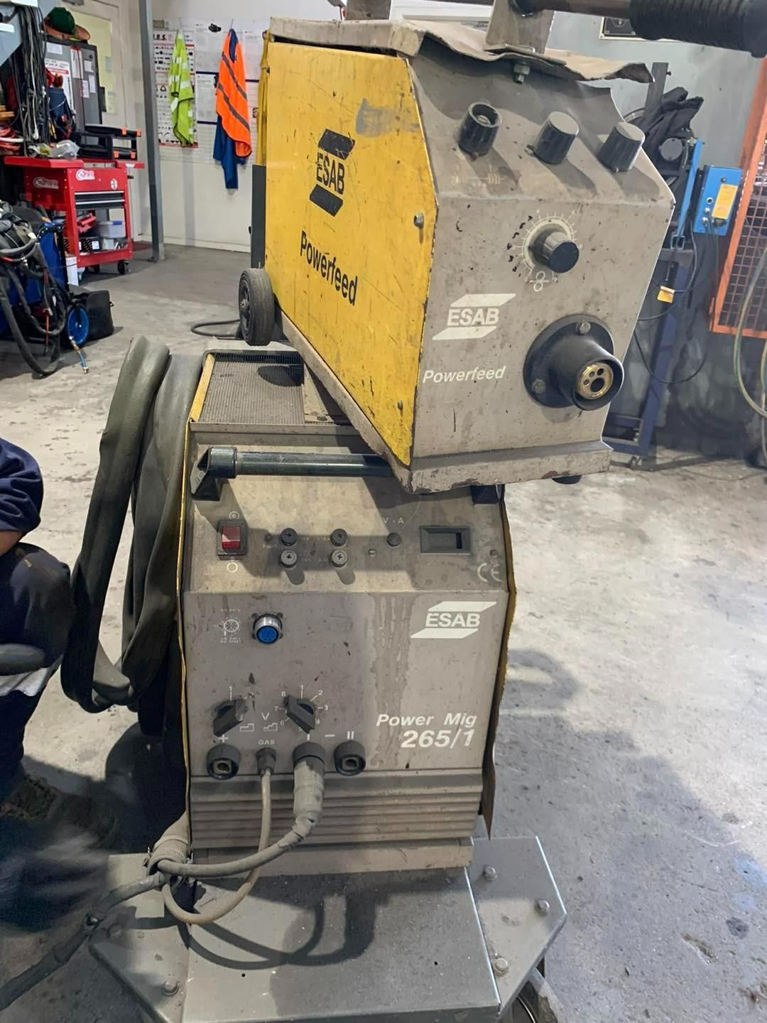 A Welding Machine Is Sitting On The Floor In A Garage — Hanby Welding & Engineering In Portsmith, QLD