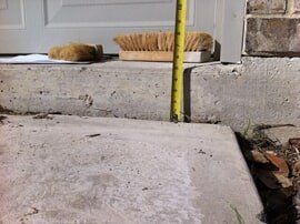 worker check foundation - foundation repair and inspection in Garland, TX