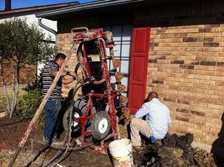 preparing concrete pier - foundation repair and inspection in Garland, TX