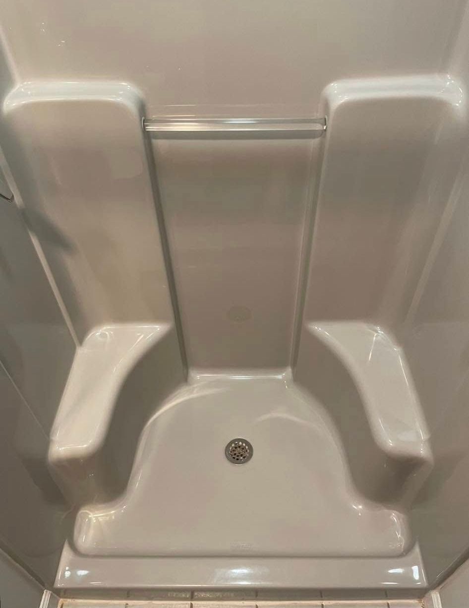 White rectangular bathtub with faucet and drain