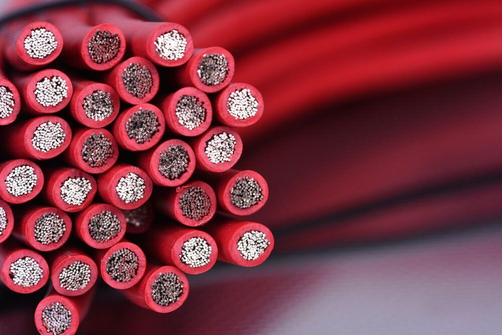 A Bunch Of Red Wires Are Stacked On Top Of Each Other — Coolmech In Gympie, QLD