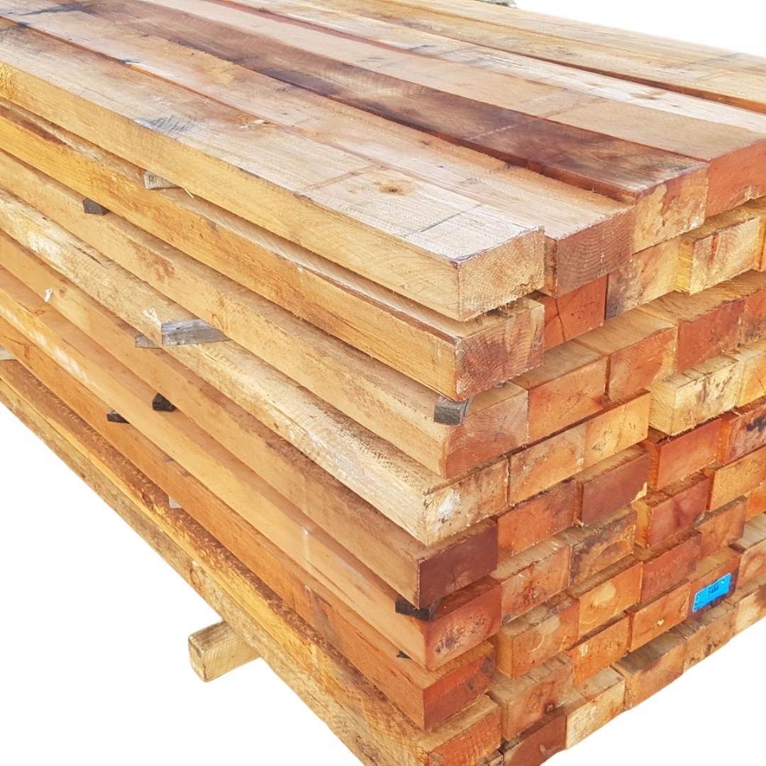 A stack of wooden boards with a blue label