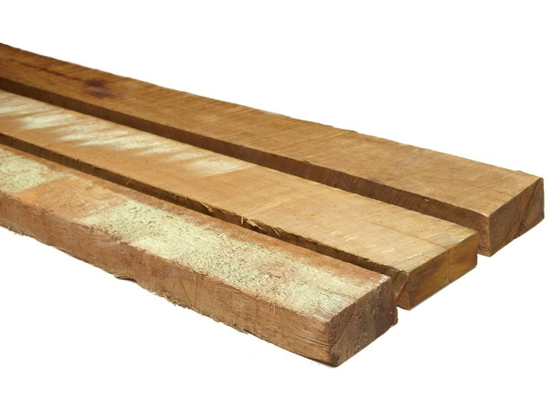 Three pieces of wood are stacked on top of each other on a white background.