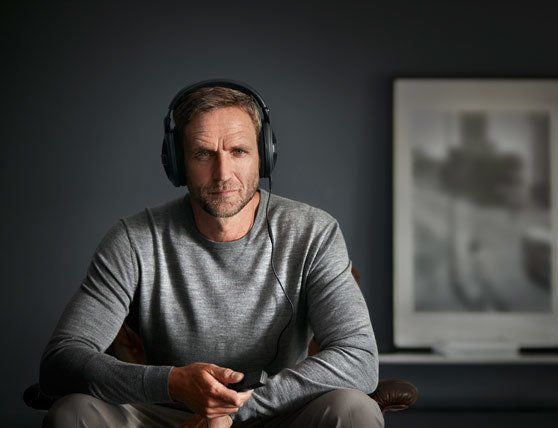 man using assistive listening device system