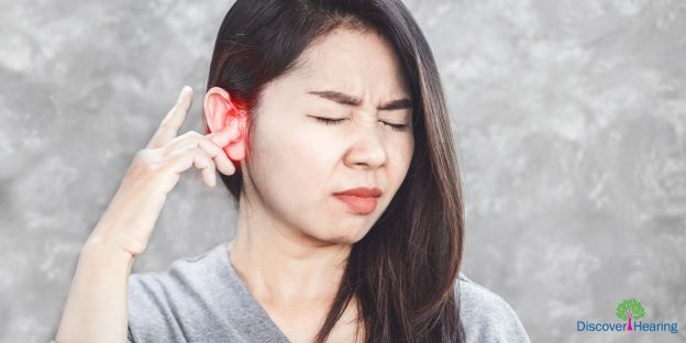 woman wearing a hearing aid