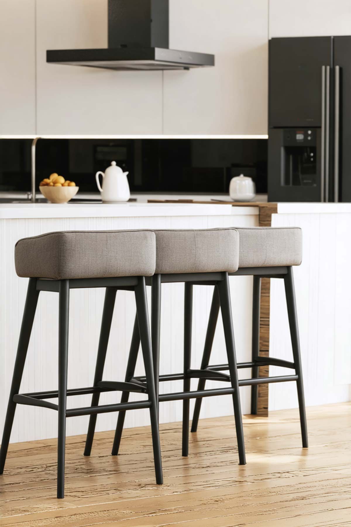 Two bar stools are sitting next to each other in a kitchen.
