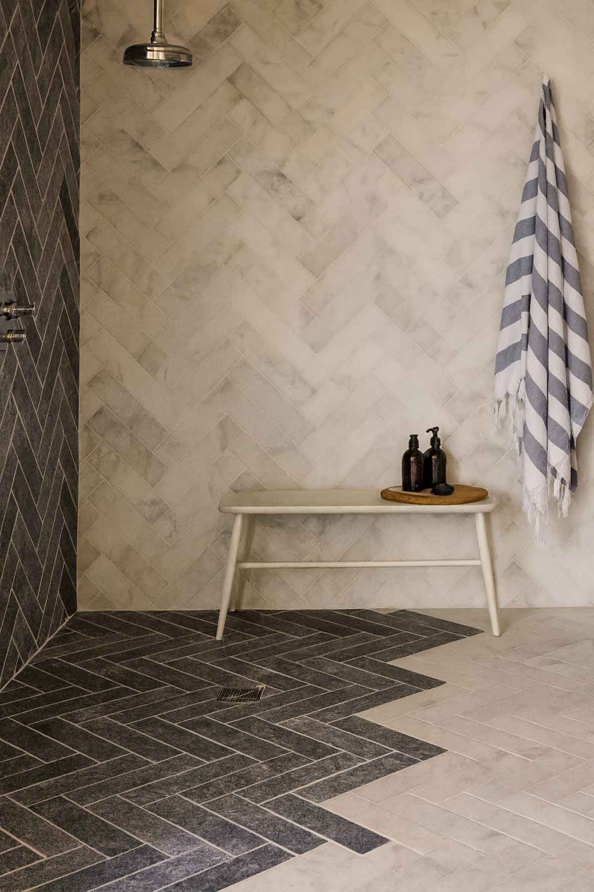 A beautiful bathroom with subway tile laid in a herringbone pattern for a luxe look.