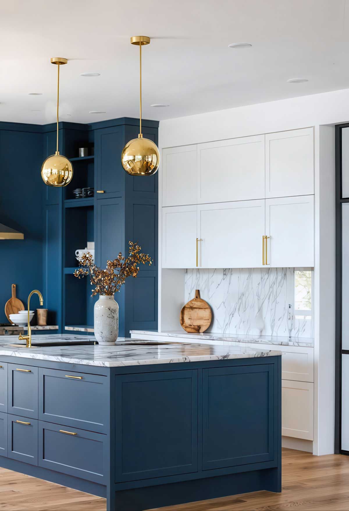 A kitchen with blue cabinets , white cabinets , and a large island.