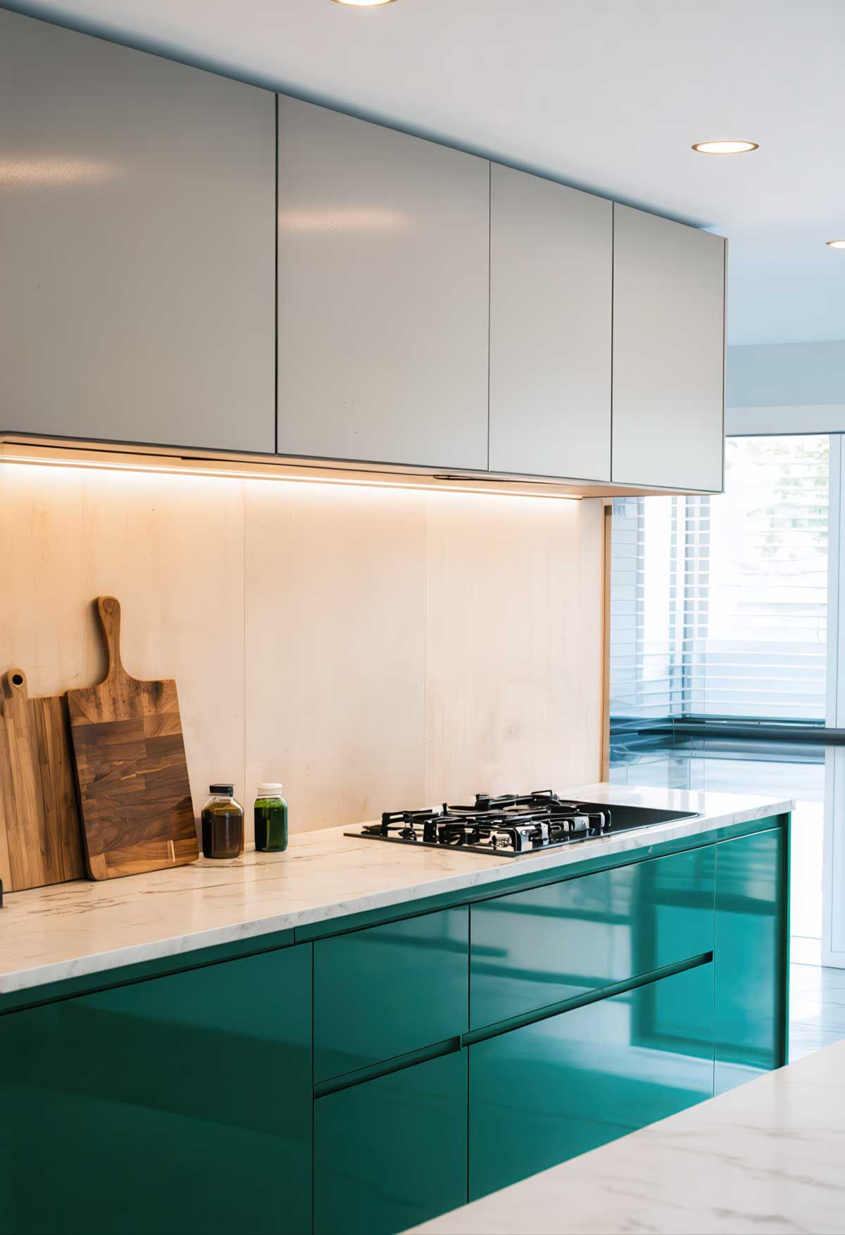 A kitchen with green cabinets and a stove top oven.