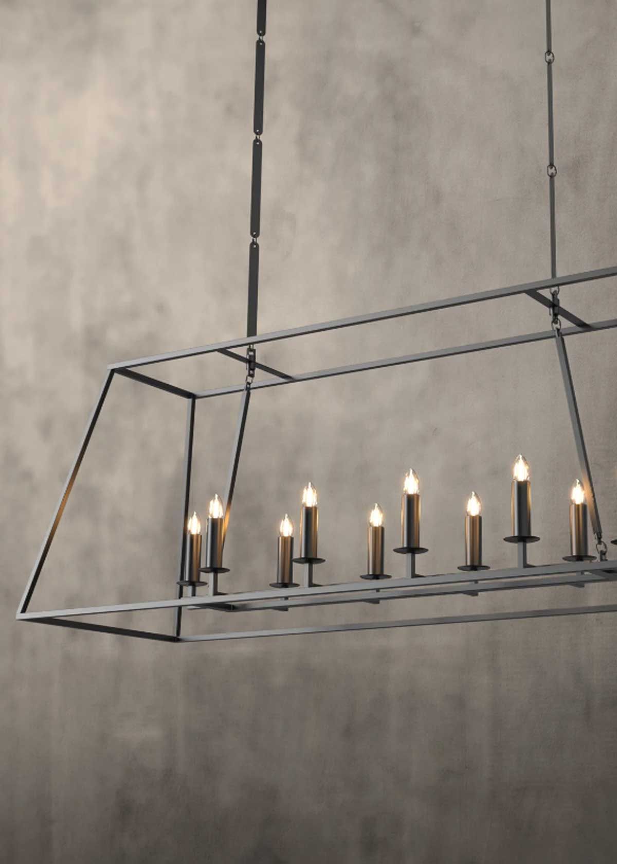 A long chandelier with candles hanging from the ceiling.