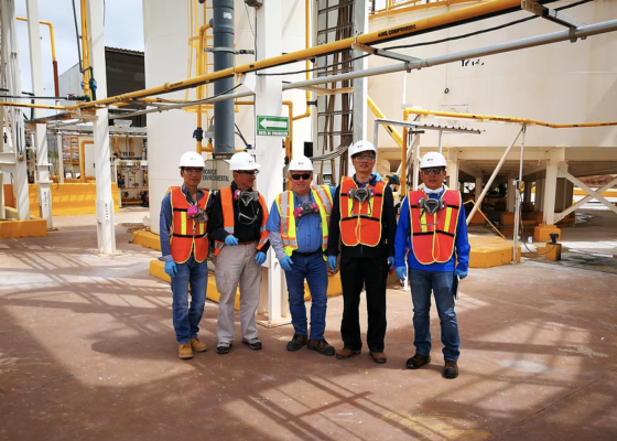 Photo of 5 employees at a mining facility