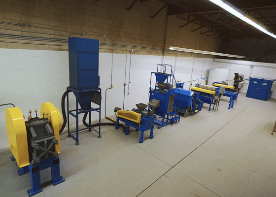 a row of blue and yellow machines in a room