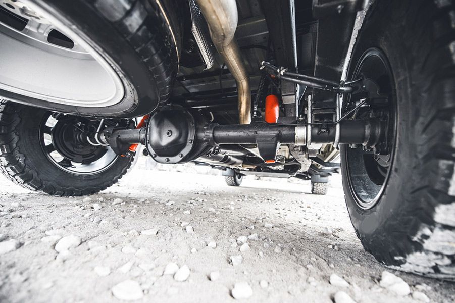 A Close-up Of the Underside of A Truck on A Dirt Road — Al's Mechanical & 4WD Grafton Repairs in Grafton, NSW