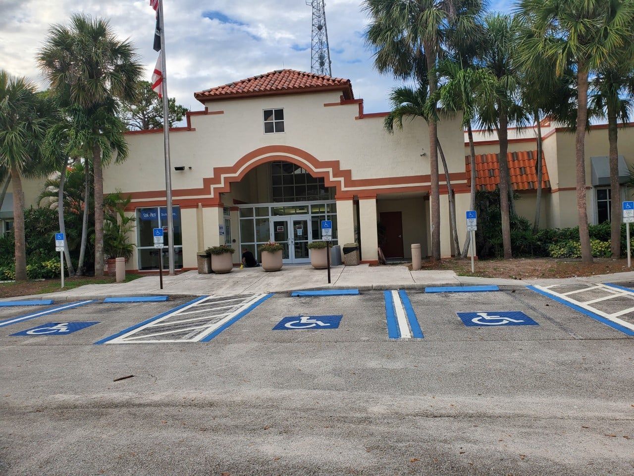 A building with a handicapped parking spot in front of it