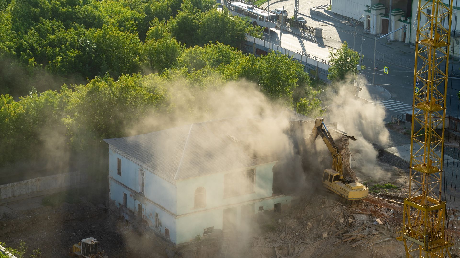 An aerial view of a building being demolished.