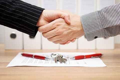 A handshake over a contract.