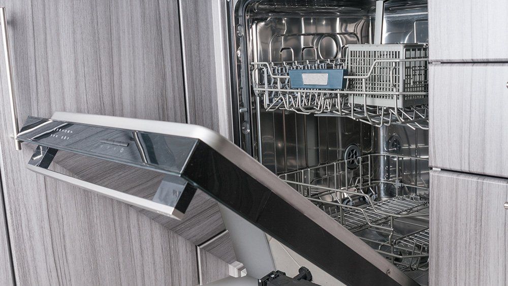 Residential Cleaners — Empty Dishwasher Machine With Opened Door in Wilmington, NC
