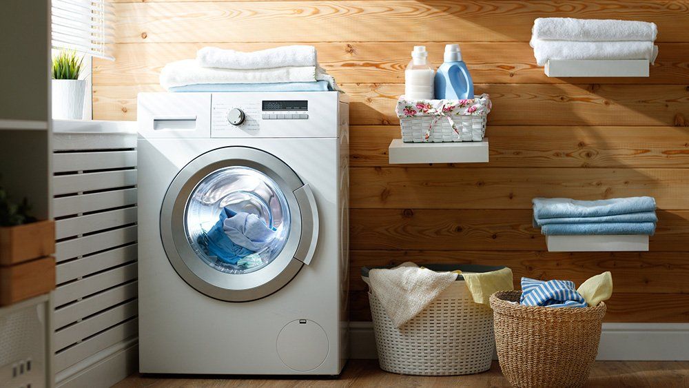 Wilmington Cleaning — Interior Of Real Laundry Room With Washing Machine in Wilmington, NC