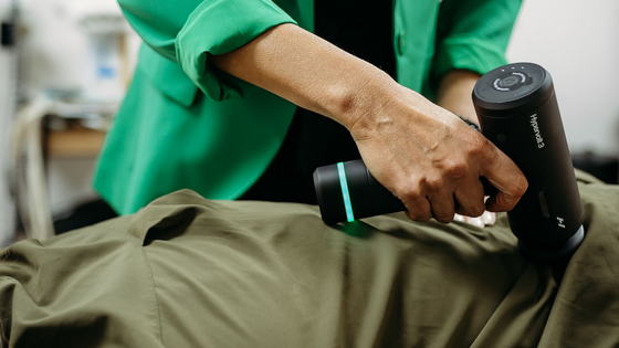 chiropractor adjusting a patients shoulder
