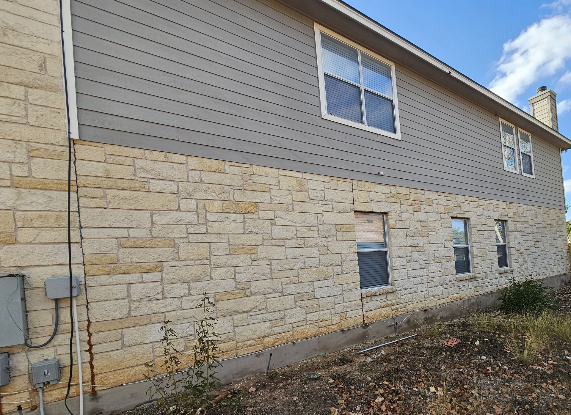 A large brick house with a lot of windows