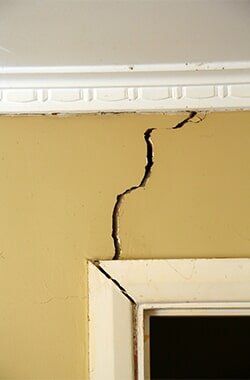Crack On The Yellow Wall — Cracked Walls in Dr. Buckner, MO