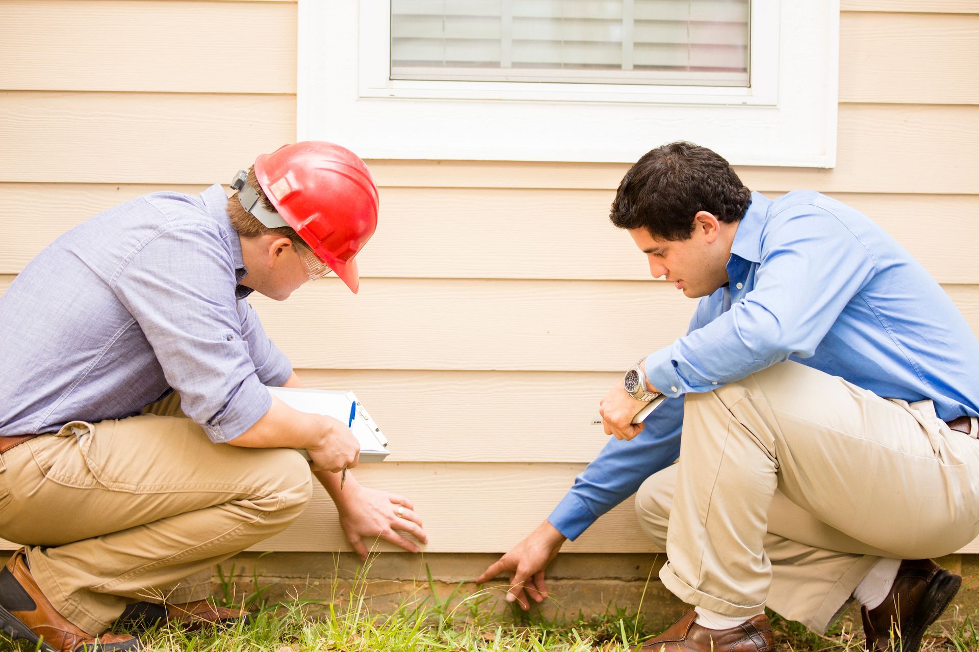 Inspectors examine a building foundation