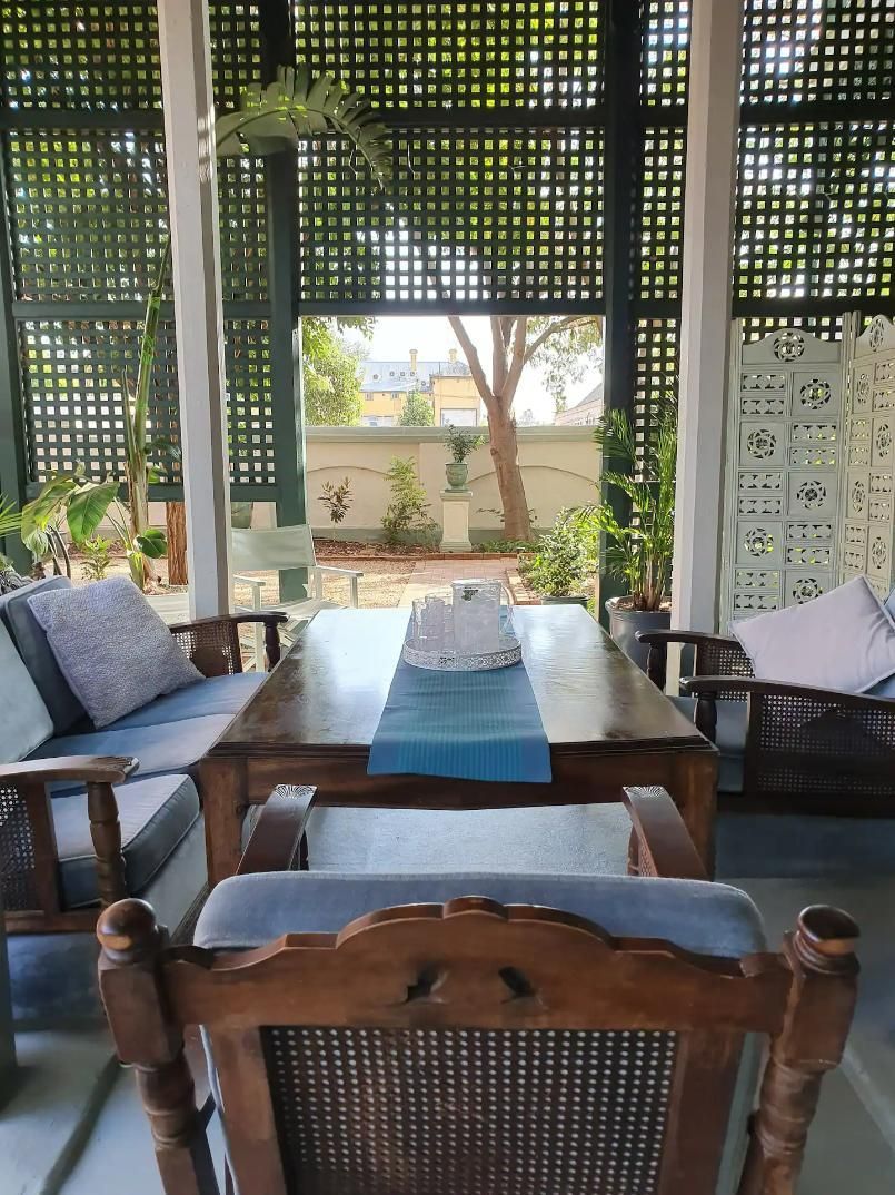 A Wooden Table With A Blue Table Runner On It — Accommodation in Forbes, NSW