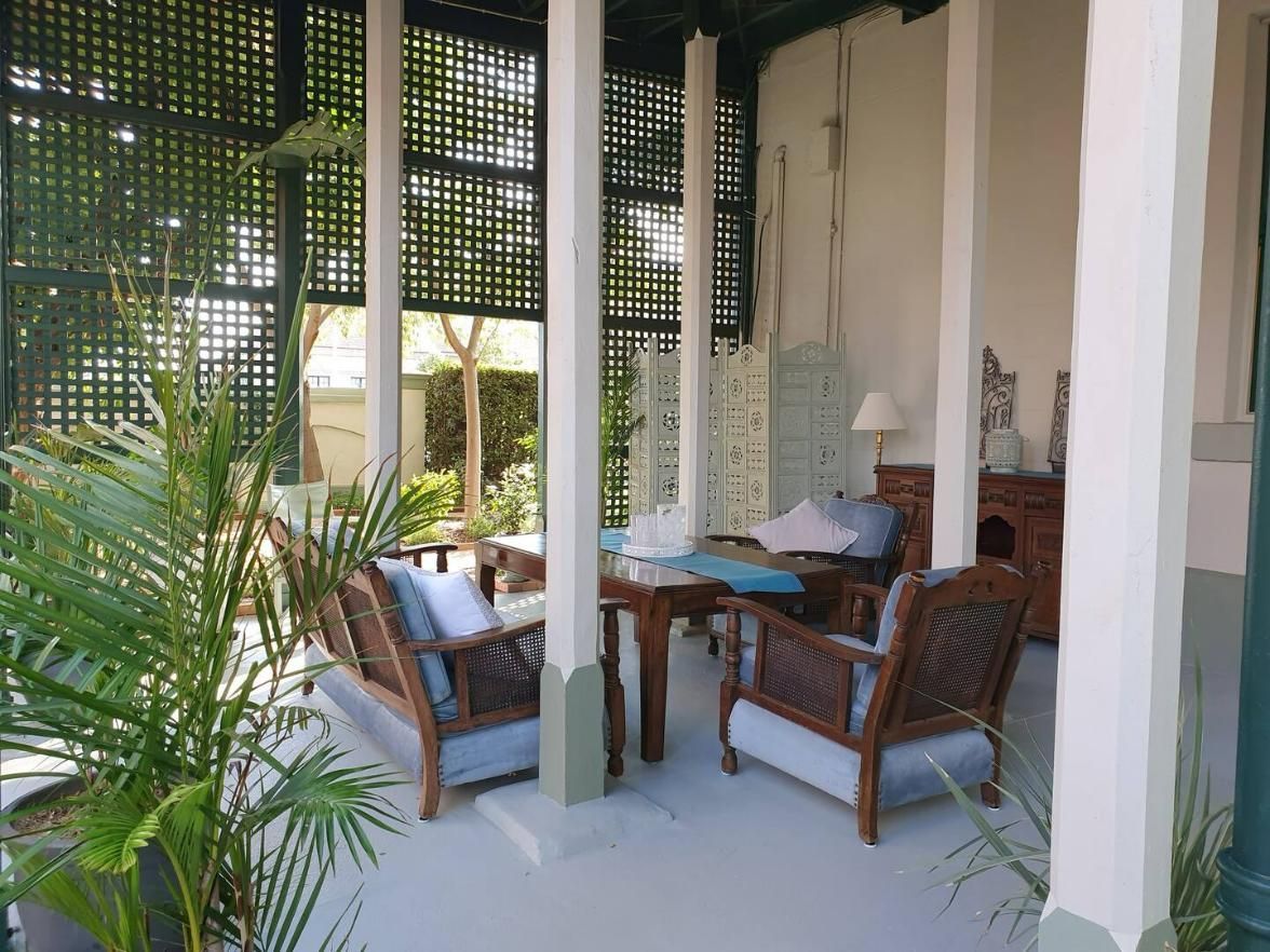 An Open Room With Chairs And A Table With A Blue Table Cloth — Accommodation in Forbes, NSW
