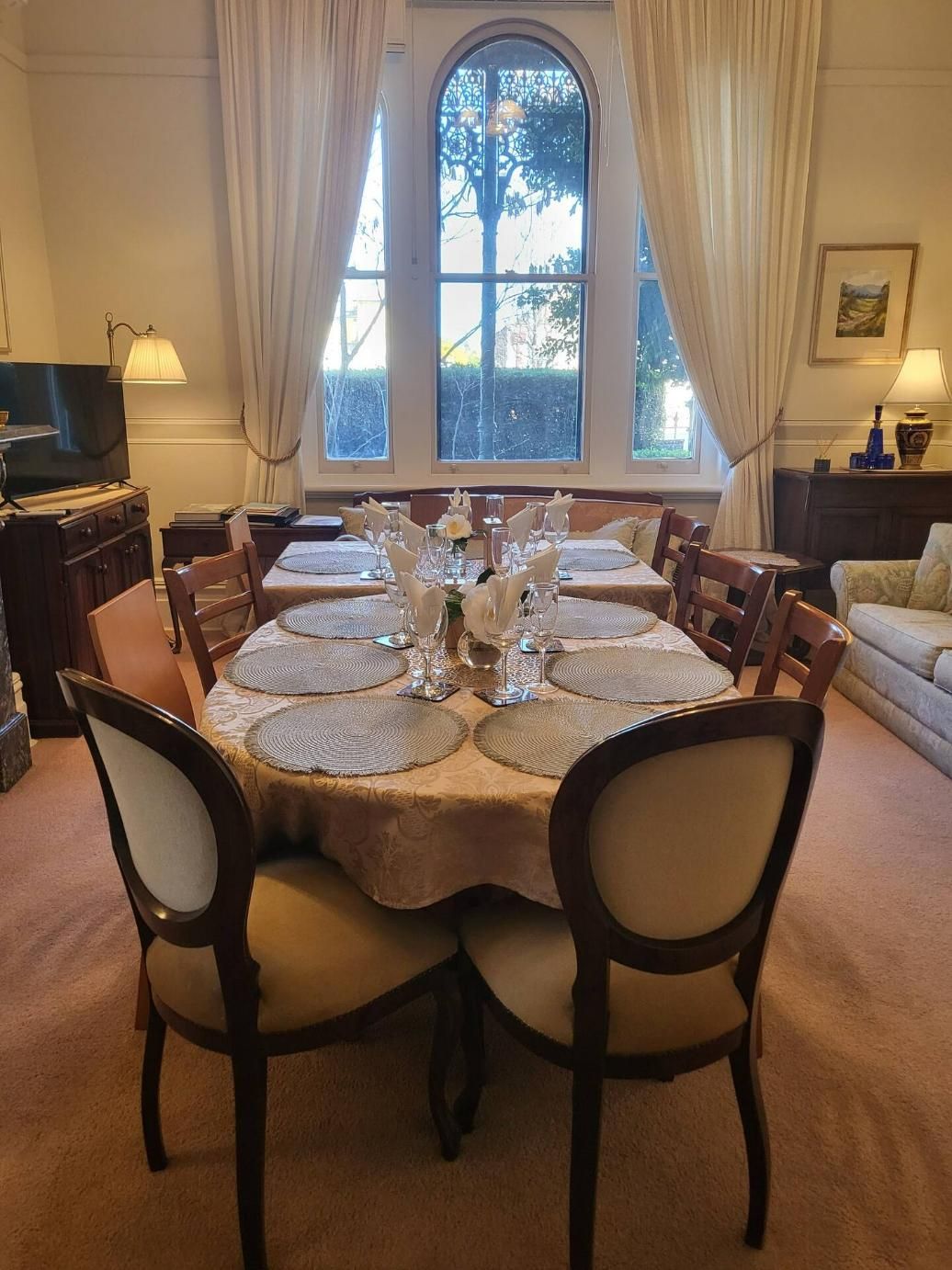 A Dining Room With a Table And Chairs and a Large Window — Accommodation in Forbes, NSW