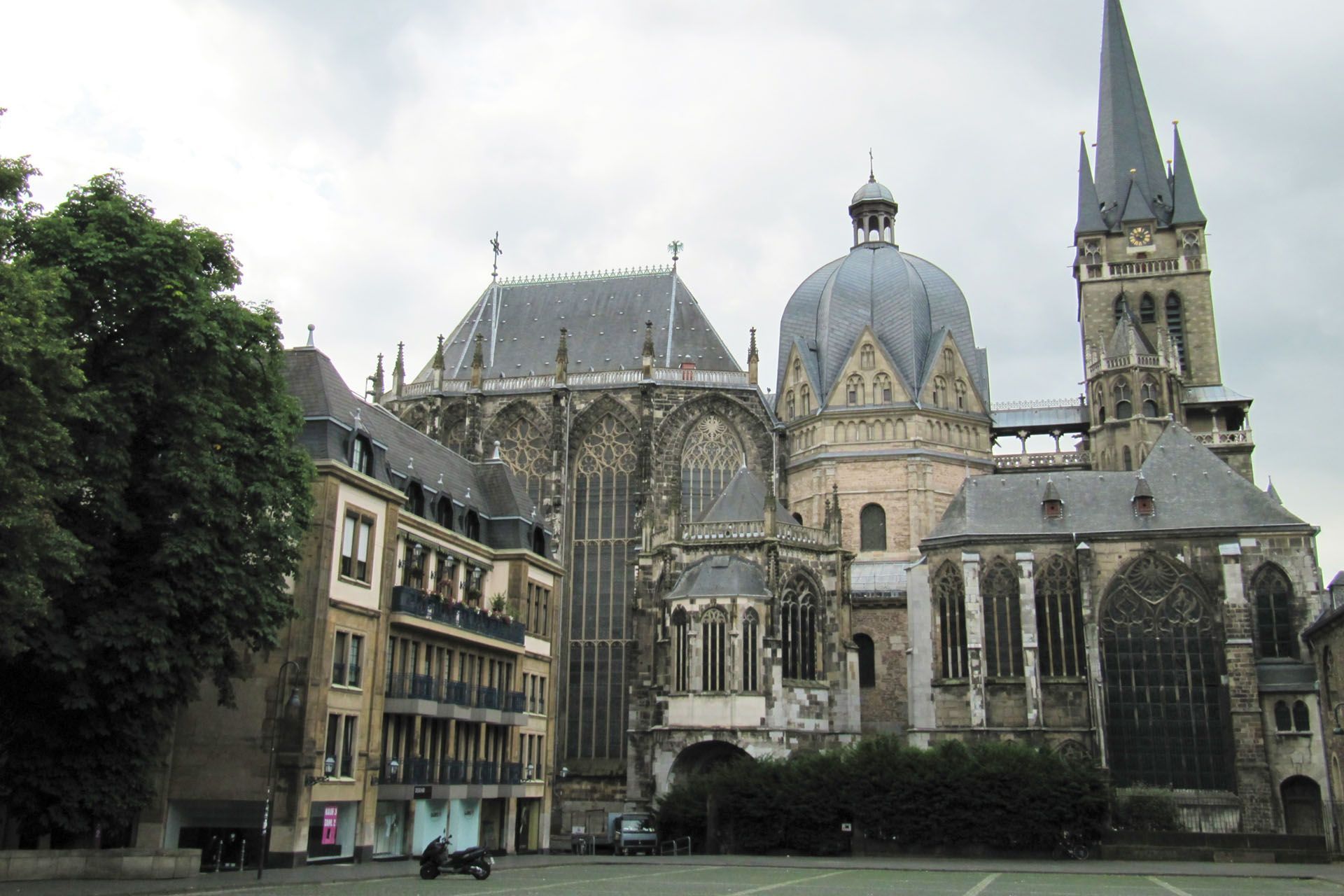 View of Aachen Cathedral in Germany, with tall Gothic architecture and a large dome.