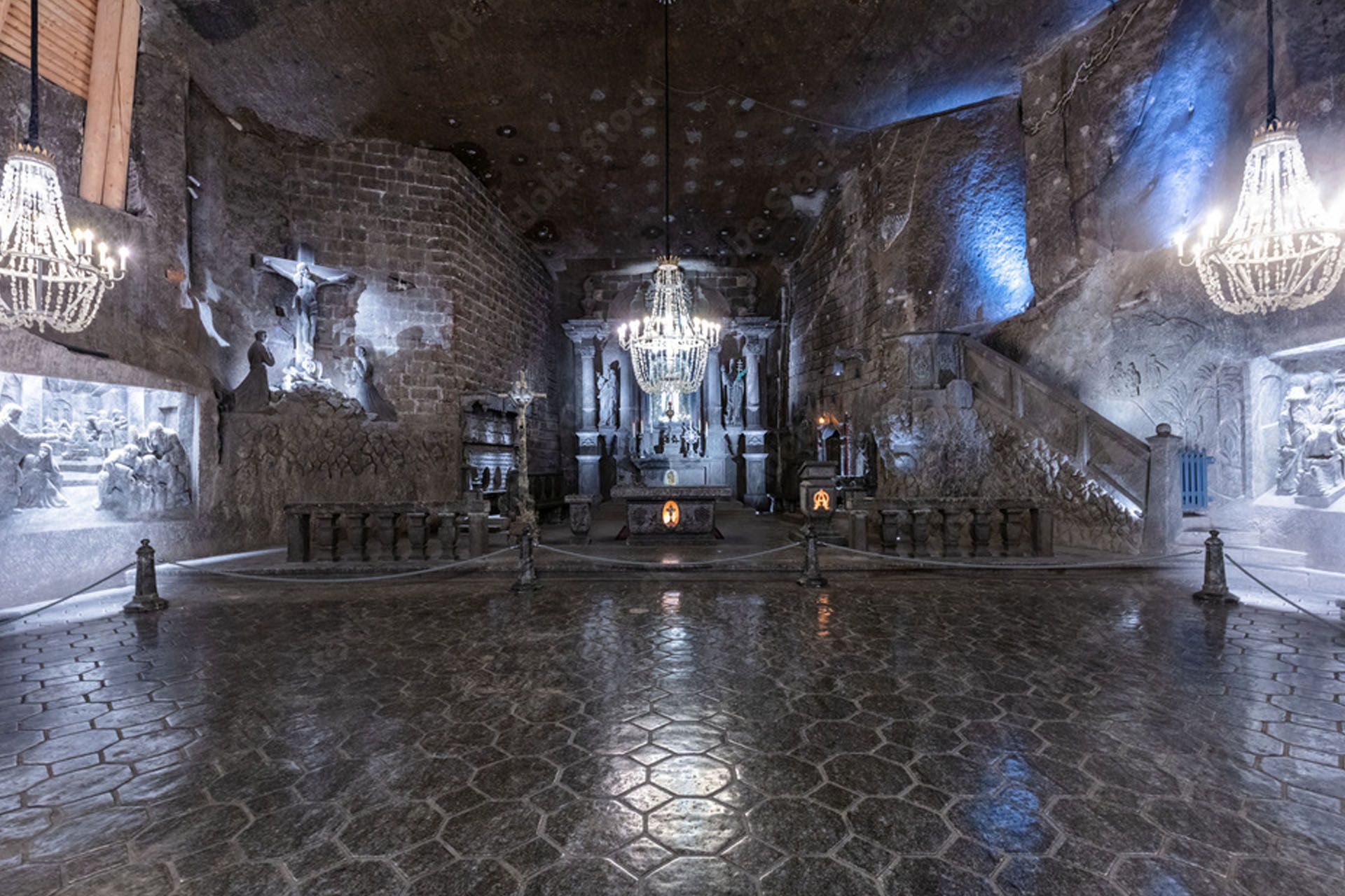 Salt cathedral with chandeliers and sculptures, underground.