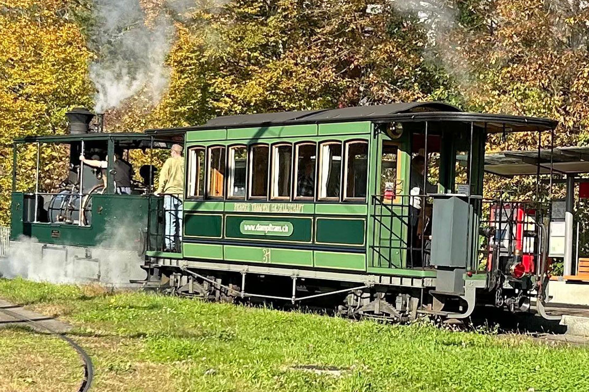 Green steam-powered train car 