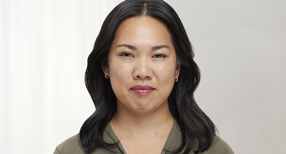 a woman wearing a green shirt is smiling after Botox treatment