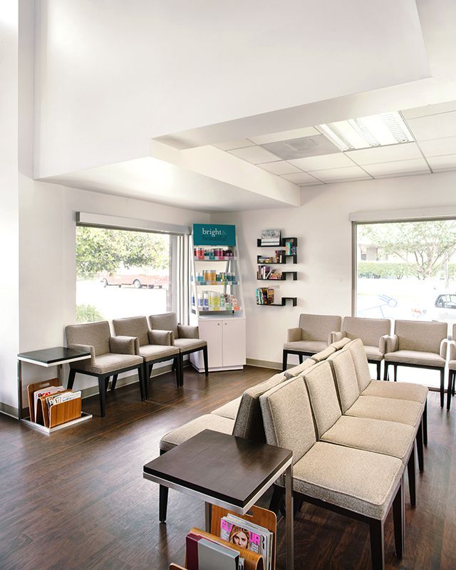a waiting room with a lot of chairs and a couch