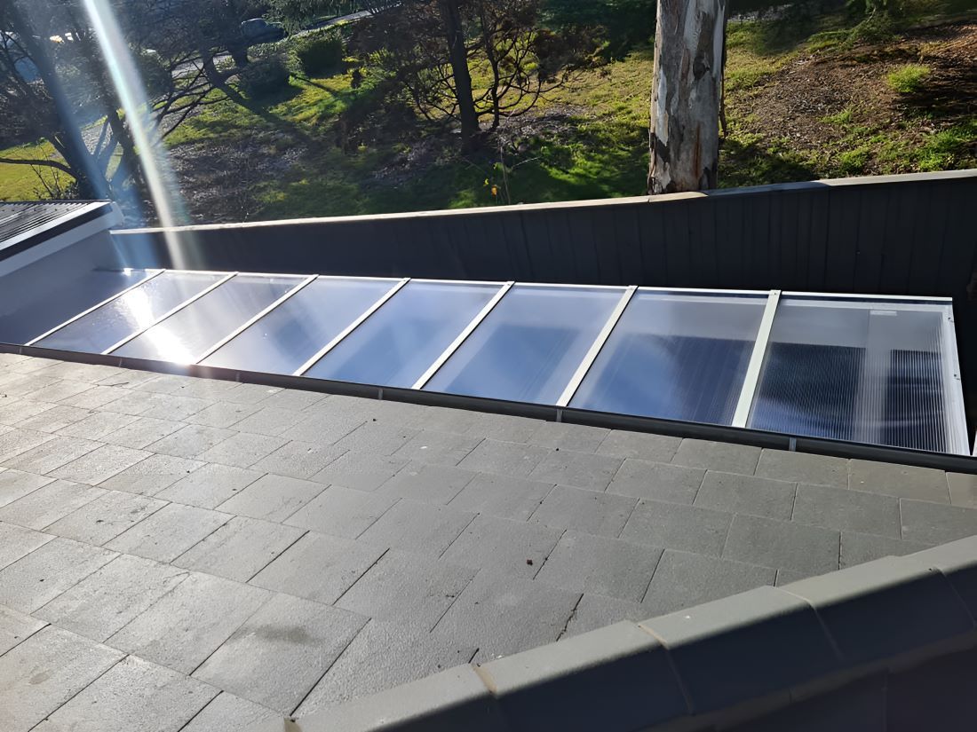 The Sun is Shining Through the Roof of a Building — Prime Built Group in Bowral, NSW