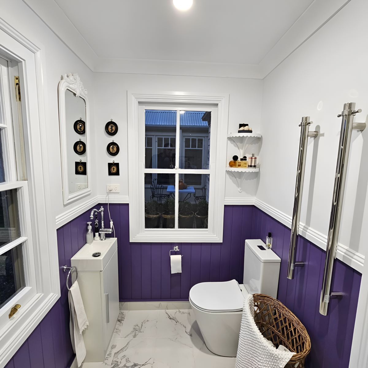 A Bathroom With Purple Walls and a Toilet — Prime Built Group in Bowral, NSW