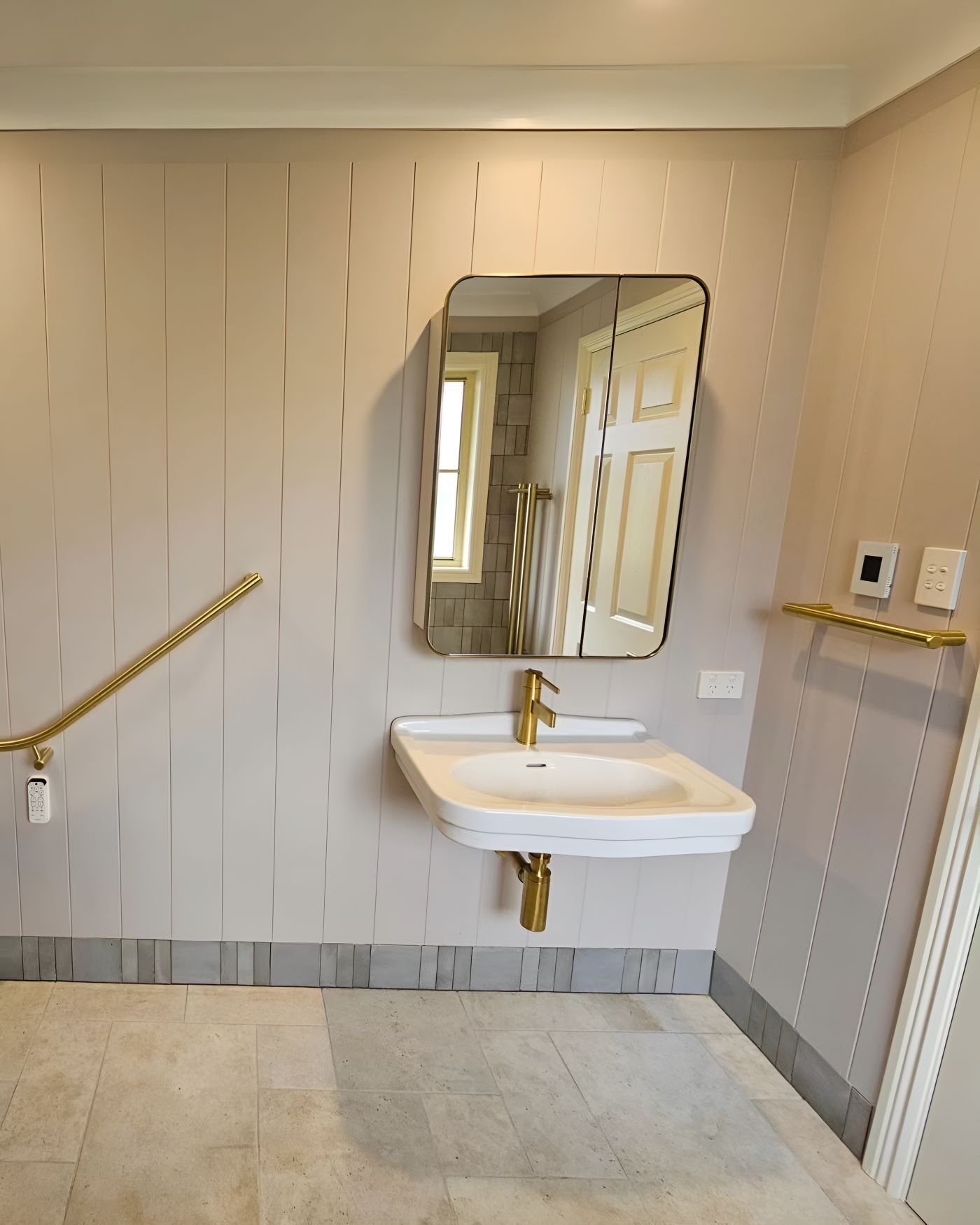 A Bathroom With a Sink and a Mirror on the Wall — Prime Built Group in Bowral, NSW