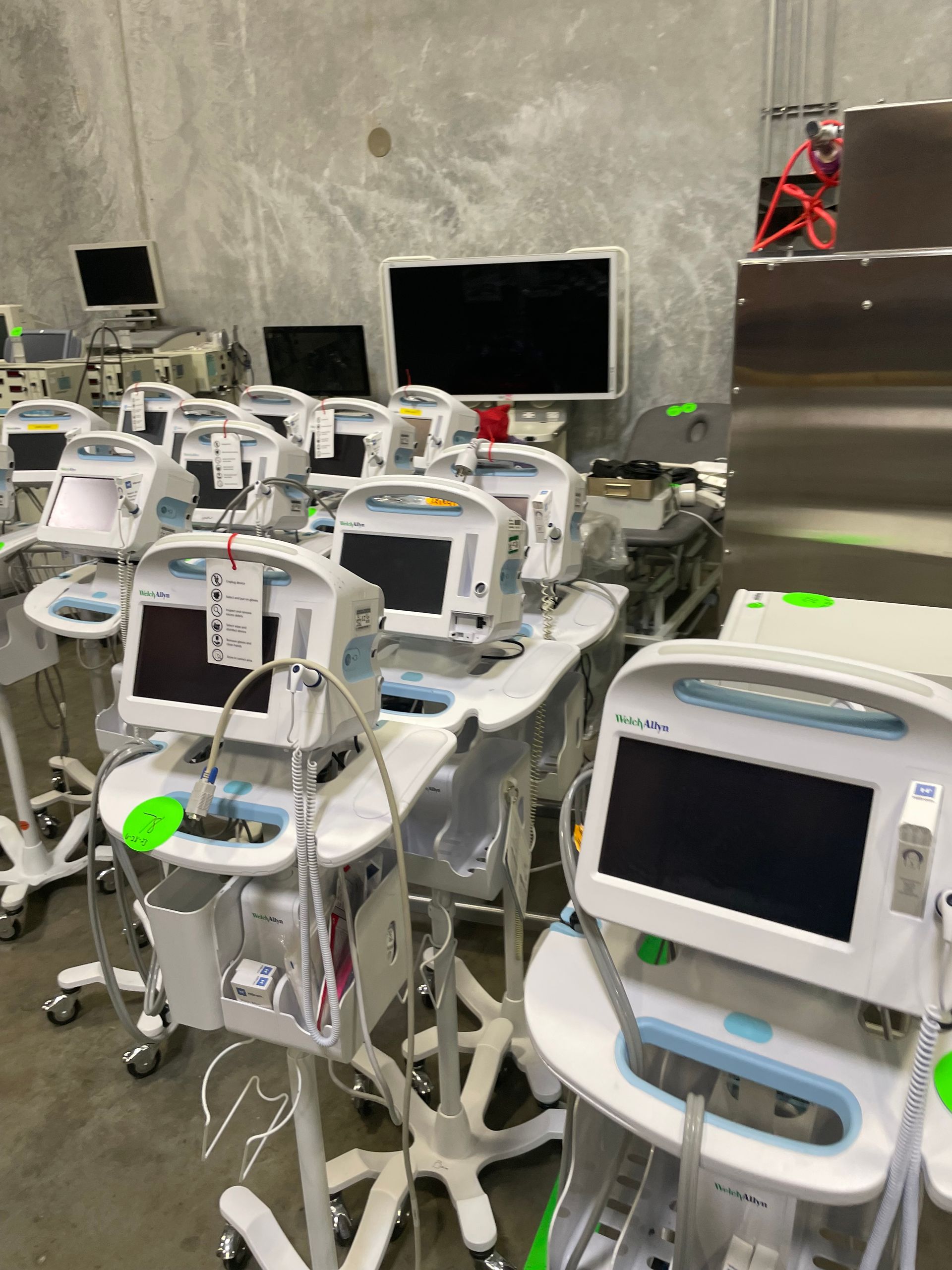 A warehouse filled with lots of medical equipment and monitors.