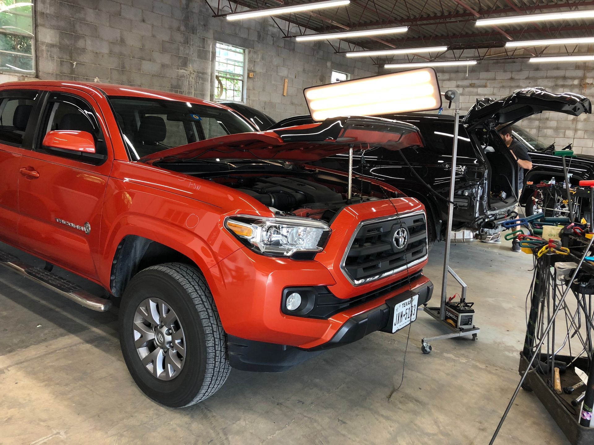 red truck during dent repair from Hail Center