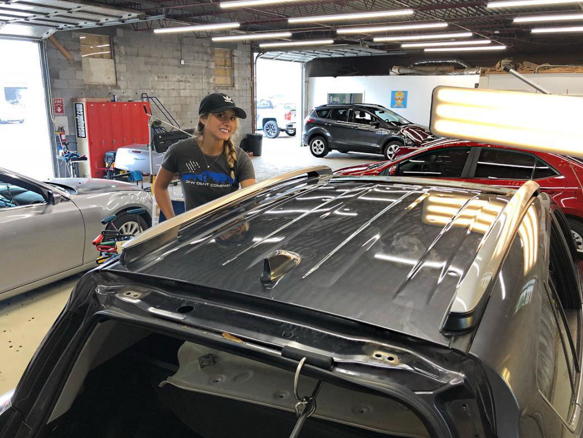 Hail Center technician during dent repair service