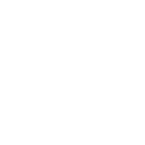 A bowl filled with small, colorful, fruit-shaped candies, including oranges, strawberries, and pineapples.