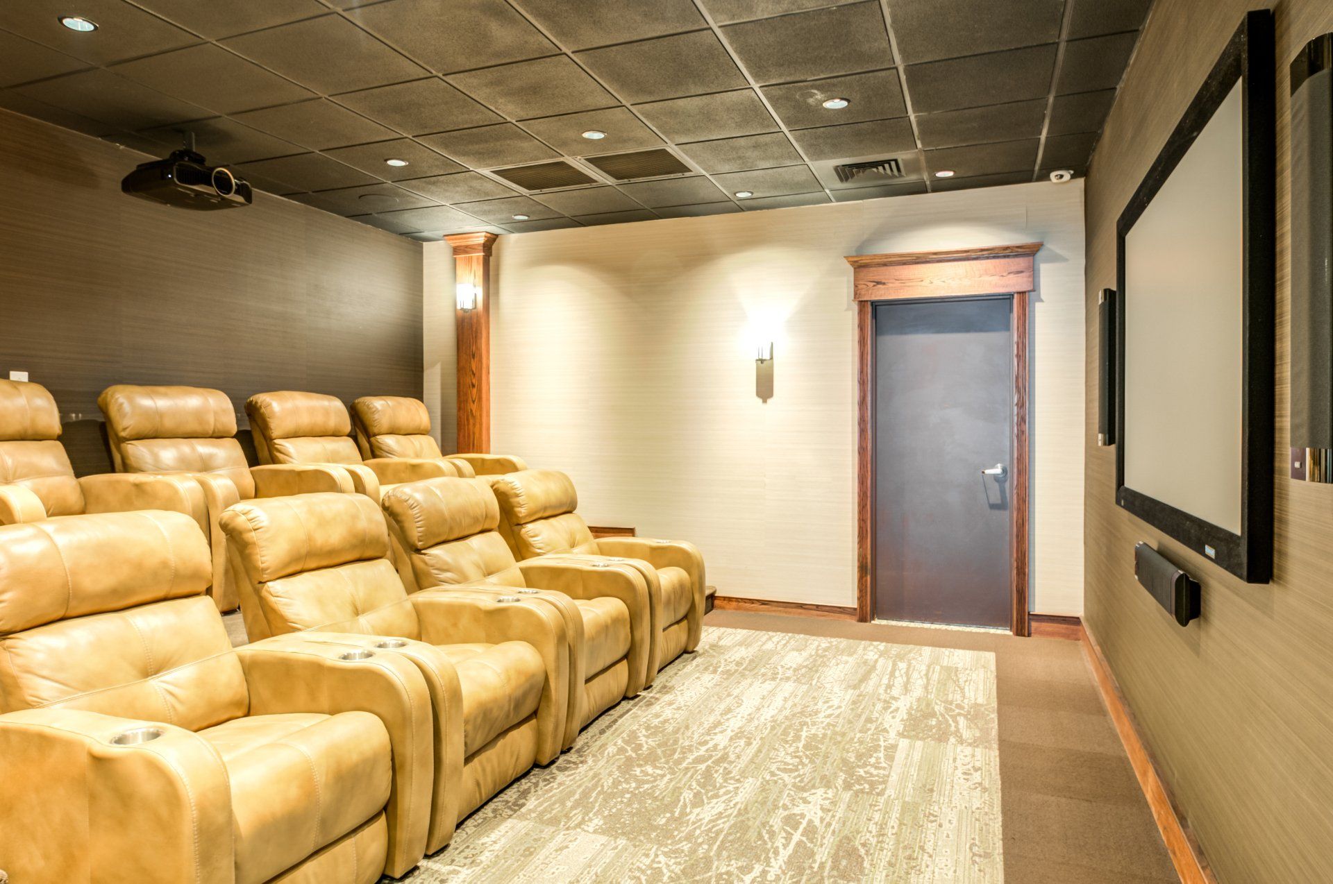 A home theater with lots of seats and a large screen.