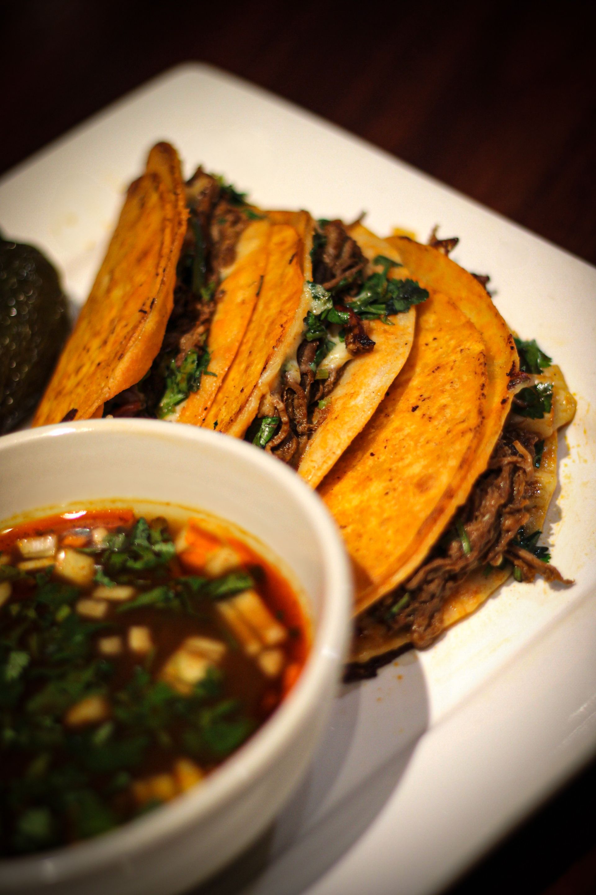 Shrimp and rice dish with stir-fried vegetables on a white plate.