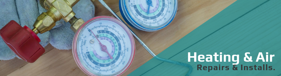 A HVAC pressure gauge manifold on a wooden surface with text reading 