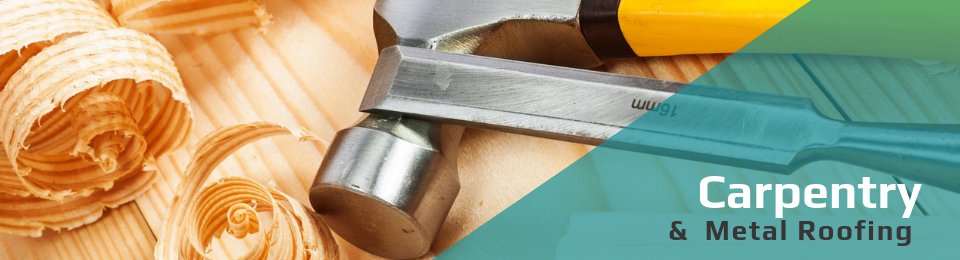 A hammer and chisel rest on wood shavings next to text reading 