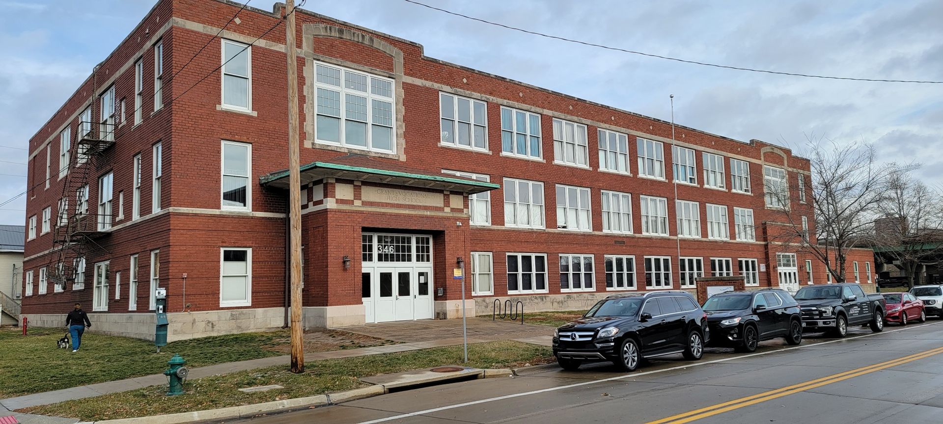 A large brick building with cars parked in front of it. — Ames, IA — Howell Investment Finance