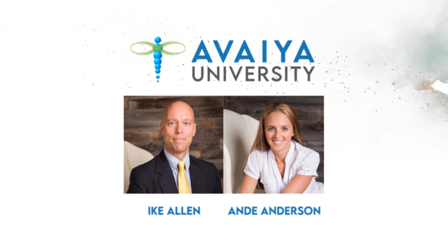 Woman speaking in a video, next to a window, with text 