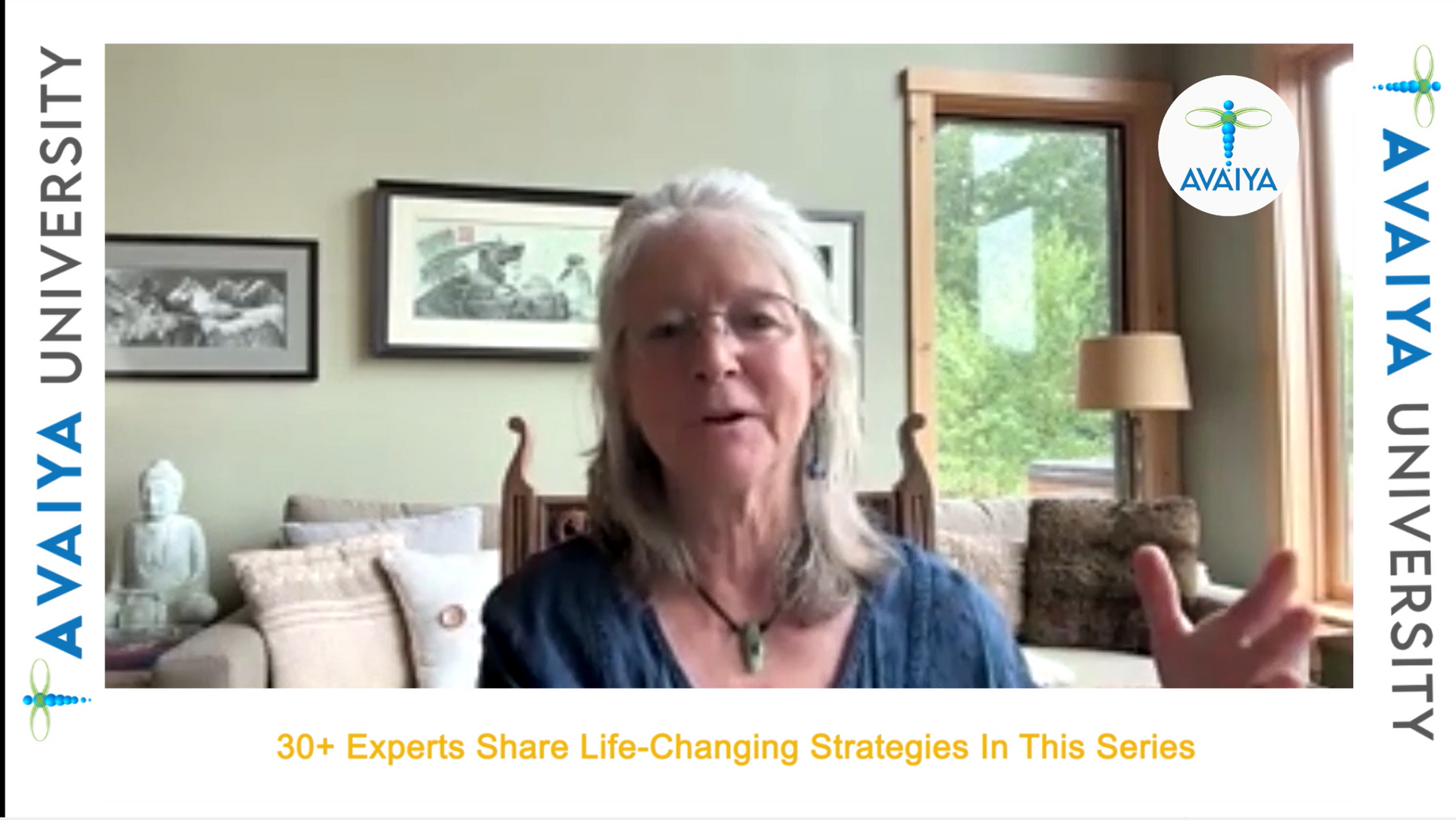 A woman is talking on a video call in a living room.