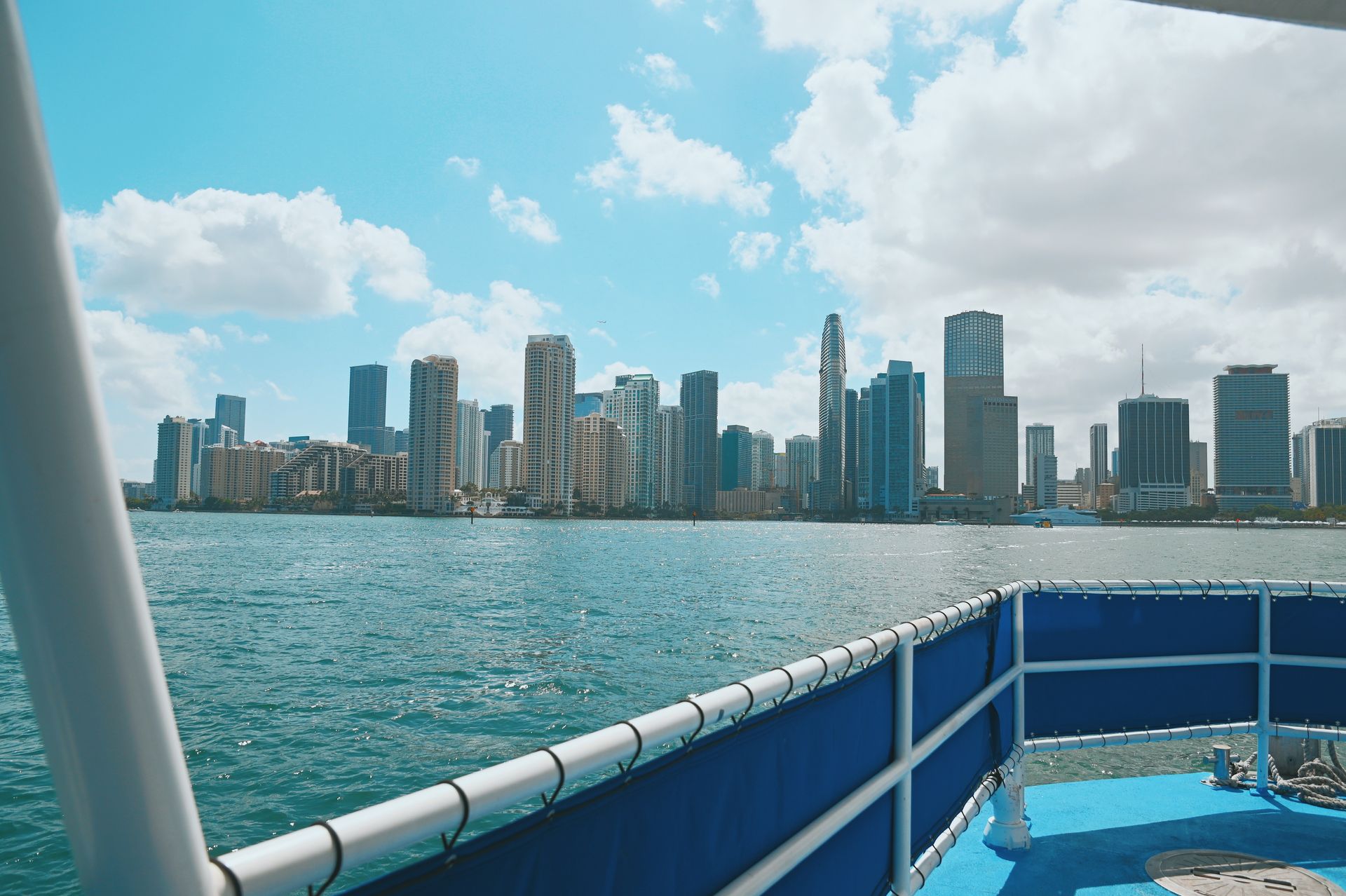 celebrity homes boat tour in Miami with the City Skyline