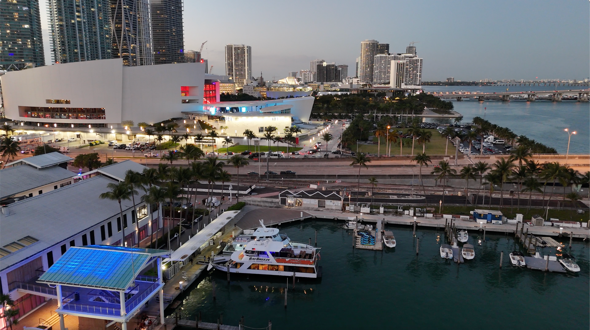 The Miami Boat Tour is located behind Victoria secret on the waterside.